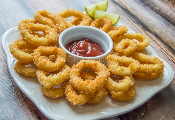 Crispy fried calamari served at The Morrissey House, a delectable appetizer featuring tender squid with a perfectly crunchy coating.